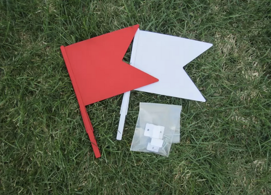 Set of red and white show jump flags with mounting brackets for equestrian courses.